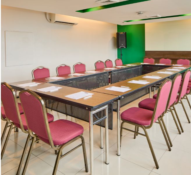 room with wood table and black chair